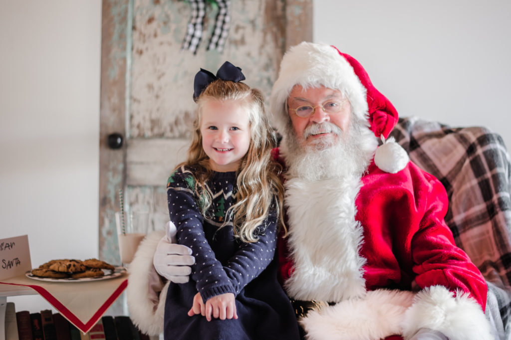 Santa Claus and little girl during 2020 Santa Mini photo session