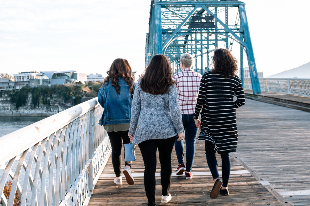 Friends walking on bridge in Chattanooga, Tennessee