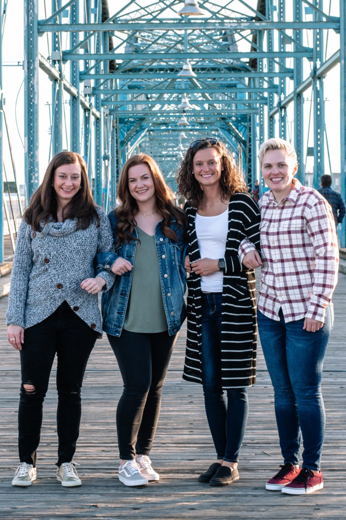 Best friends posing on bridge in Chattanooga, TN during a photo session
