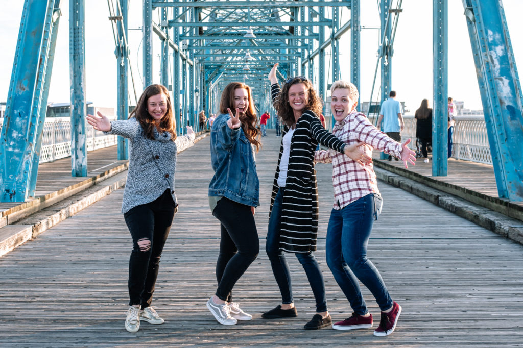 Best Friends having fun and posing on a bridge in Chattanooga during a photo shoot