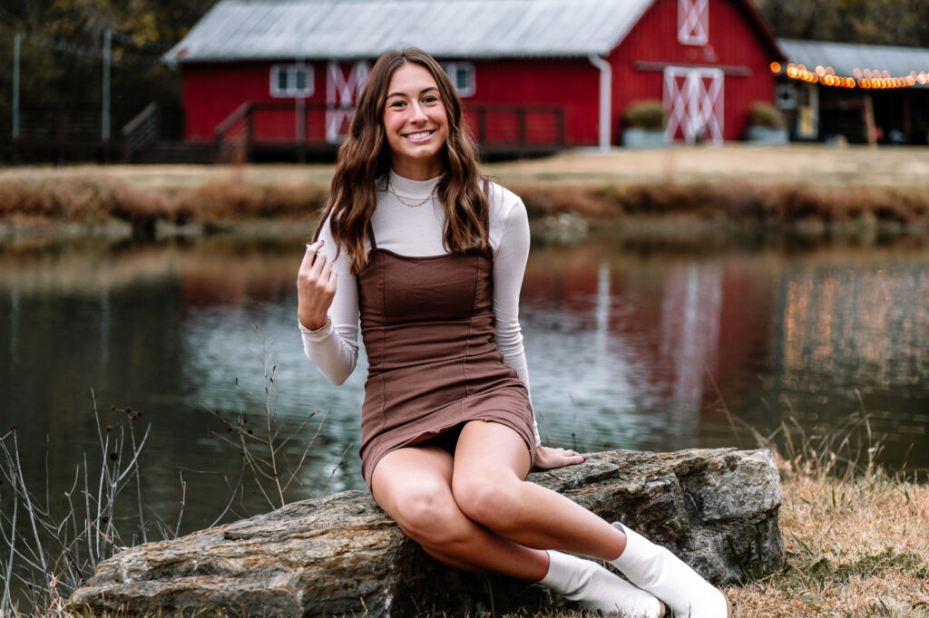 What to Wear for Your Senior Pictures – Seasonal Outfit Ideas for high school Seniors - Chattanooga senior girl in winter outfit on farm with turtleneck, dress, and booties